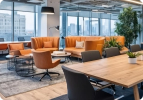 Modern office lounge and meeting area with sofas and tables